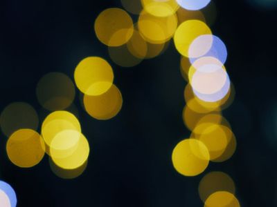 Minimalist abstract circles glowing in deep violet background